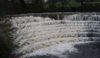 The mighty river Etherow thunders over the weir