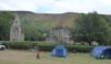 Valle Crucis abbey surrounded by campers