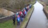 Walkers on the Macclesfield Canal gaze at the Trent & Mersey Canal below