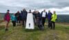 The trig point on Gun Hill providing support to Martyn