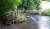a bridge and stepping stones unused on this walk