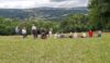 Having climbed a steep track, the walkers enjoy a coffee stop overlooking the Dee valley