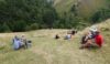 The walkers enjoy lunch above the Coldeaton footbridge over the River Dove